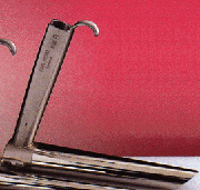 Close up of a laryngoscope against a red background