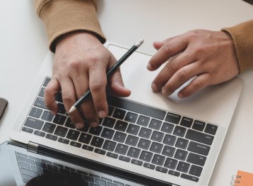 Overhead shot of a person working on a laptop