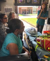 Emergency Medicine Global Fellows inside and EMT truck