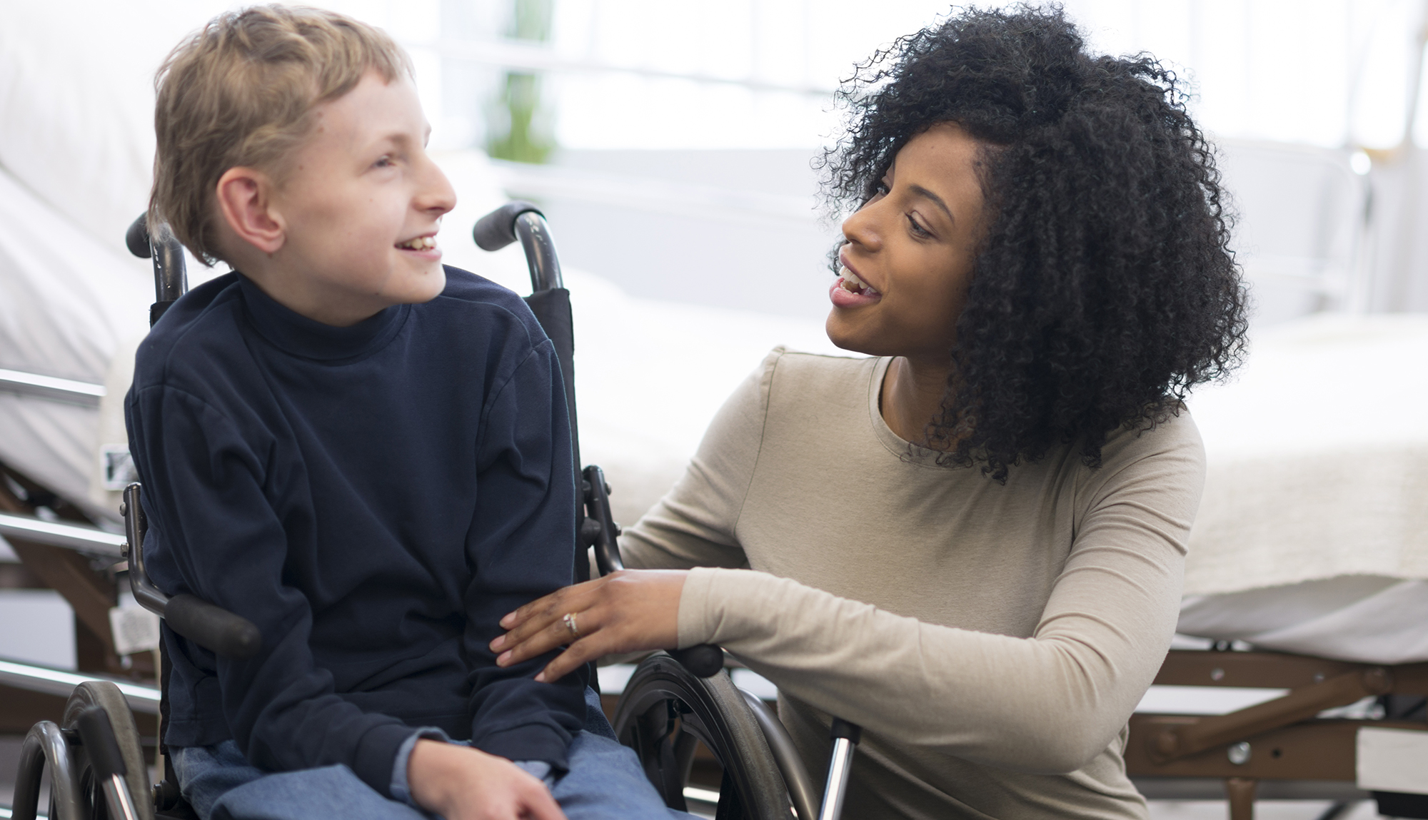 A resident laughs with a patient.