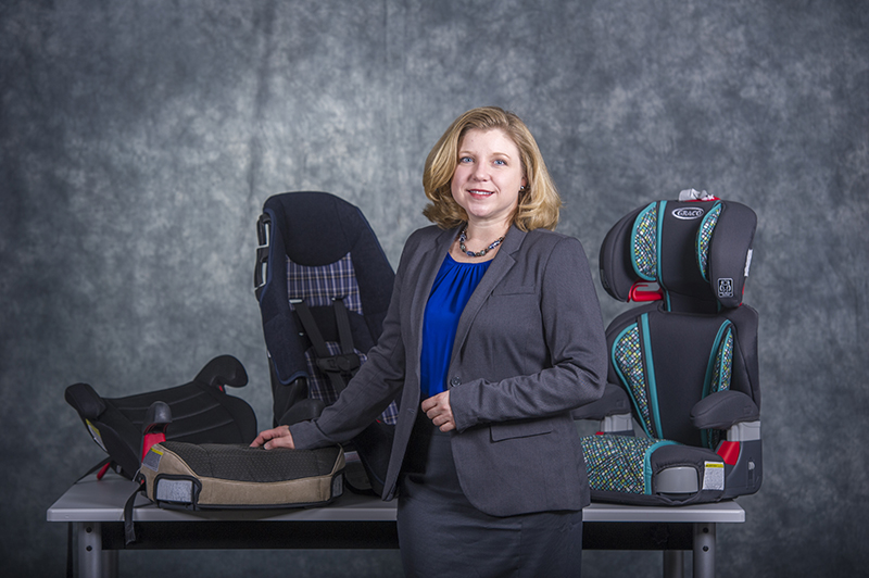 Dr. Kelli England with booster seats